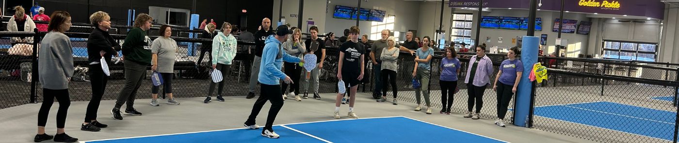 Group of People Taking Pickleball Lessons